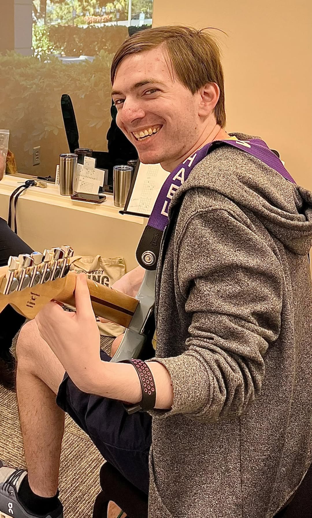 Student with acoustic guitar