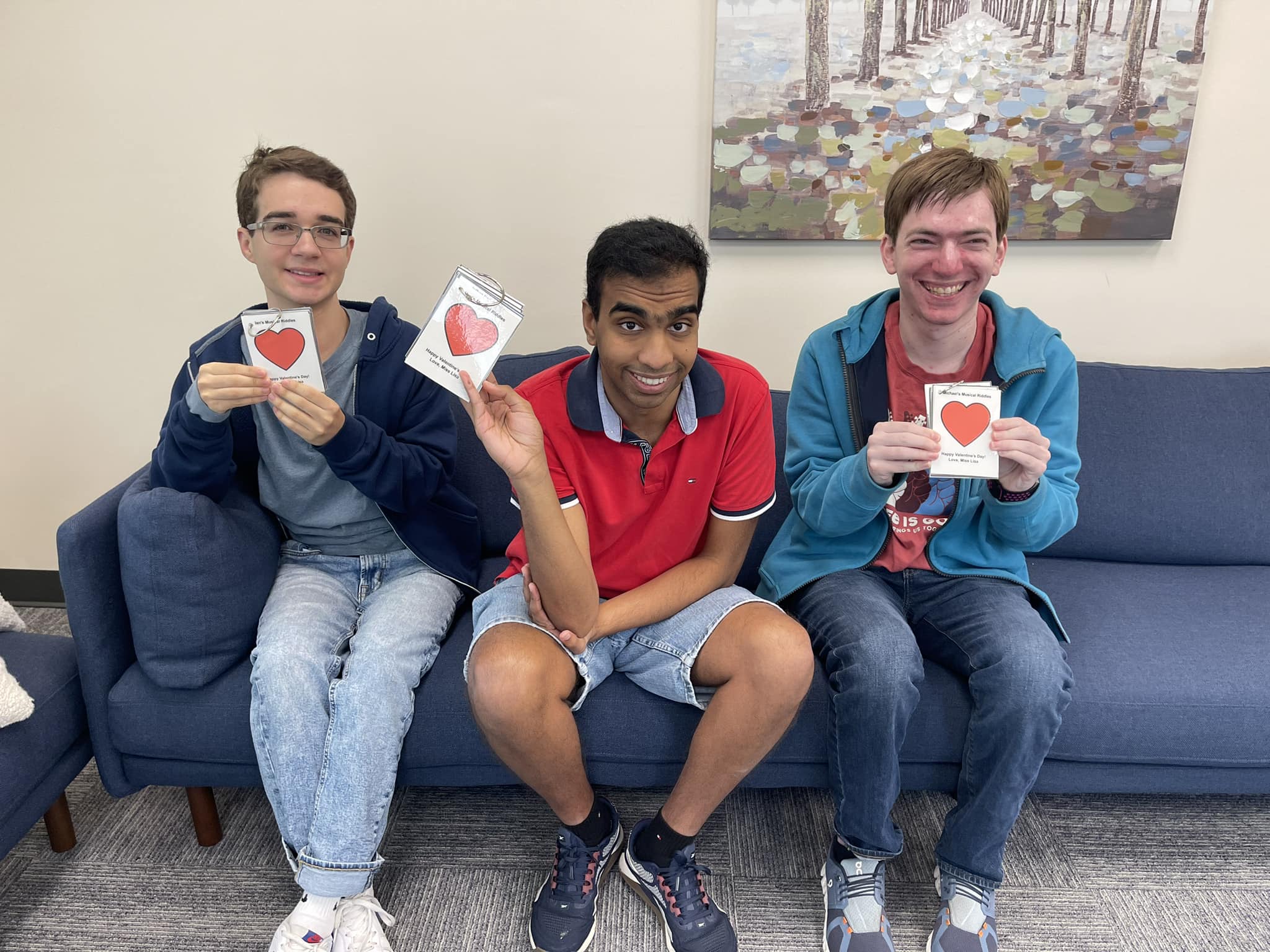 Students holding heart cards
